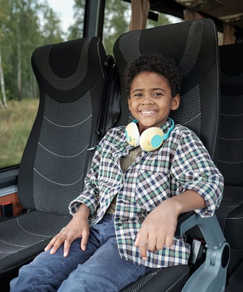 happy-boy-riding-bus-alone-S3VEVSM