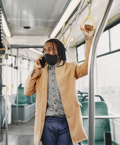 young-african-businessman-standing-in-a-bus-RCN3M9M